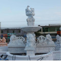 Outdoor marble fountain and sculpture with angel and lion